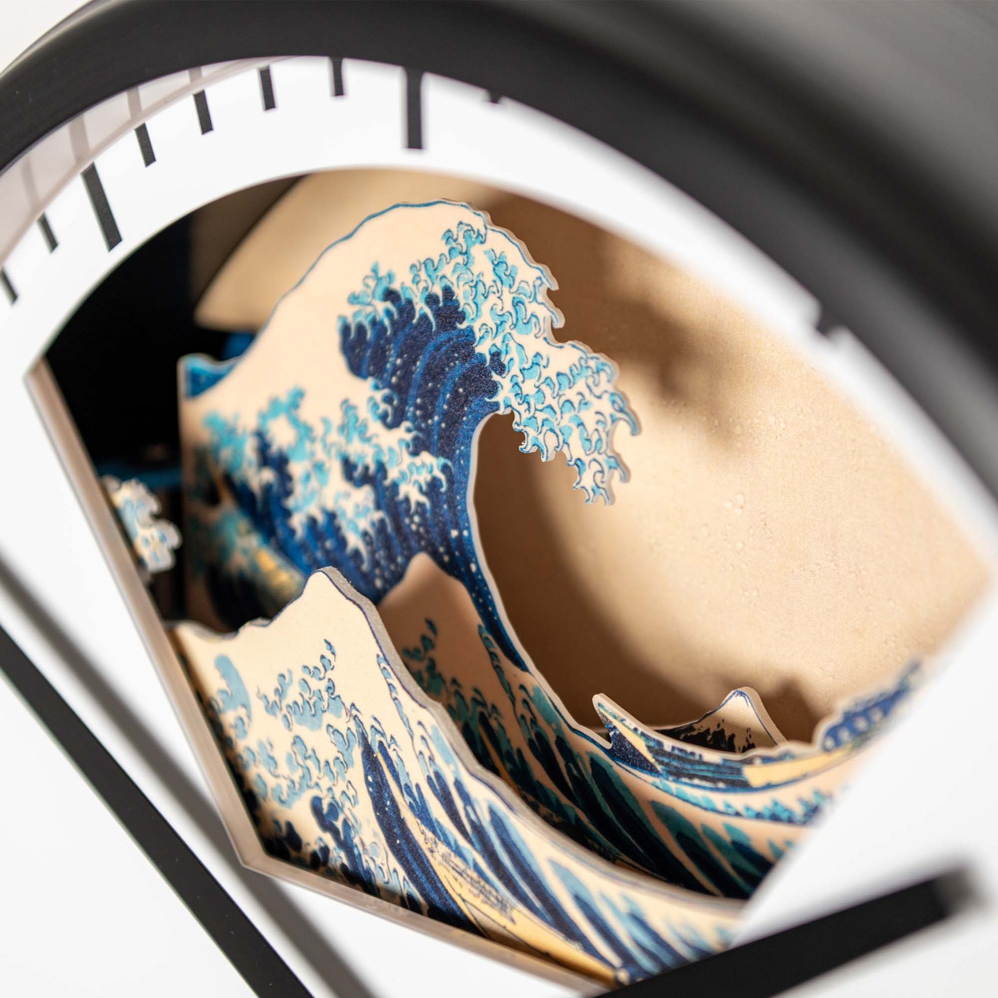 The Hokusai Tide Art Clock showcases the iconic Great Wave off Kanagawa with blue waves, all framed by a sleek black frame.