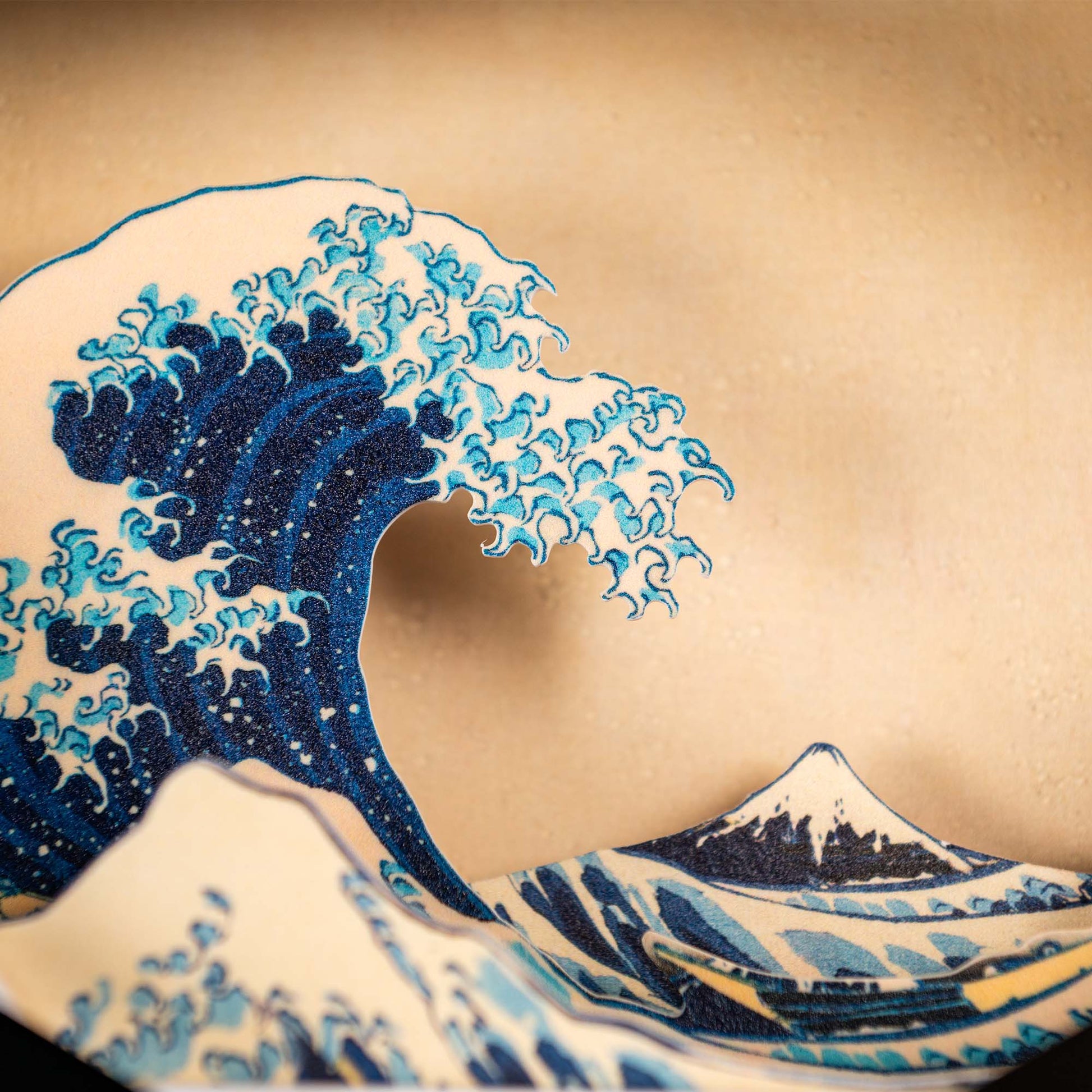 Inspired by the Hokusai Tide Art Clock, this design features a large blue wave on a beige backdrop, reminiscent of The Great Wave Off Kanagawa.