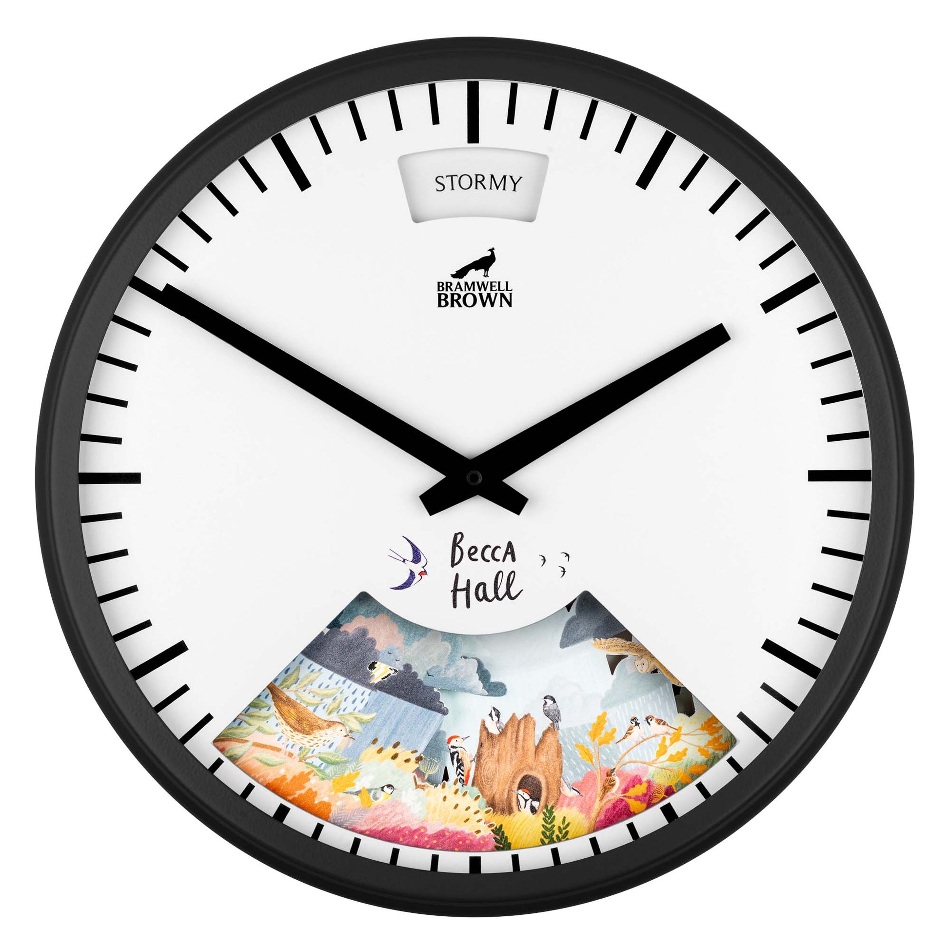 A round wall clock with black frame, bold black hands, and black tick marks. The top displays STORMY, and the bottom has colorful illustrated nature scenes labeled Becca Hall. The center shows the Bramwell Brown logo.