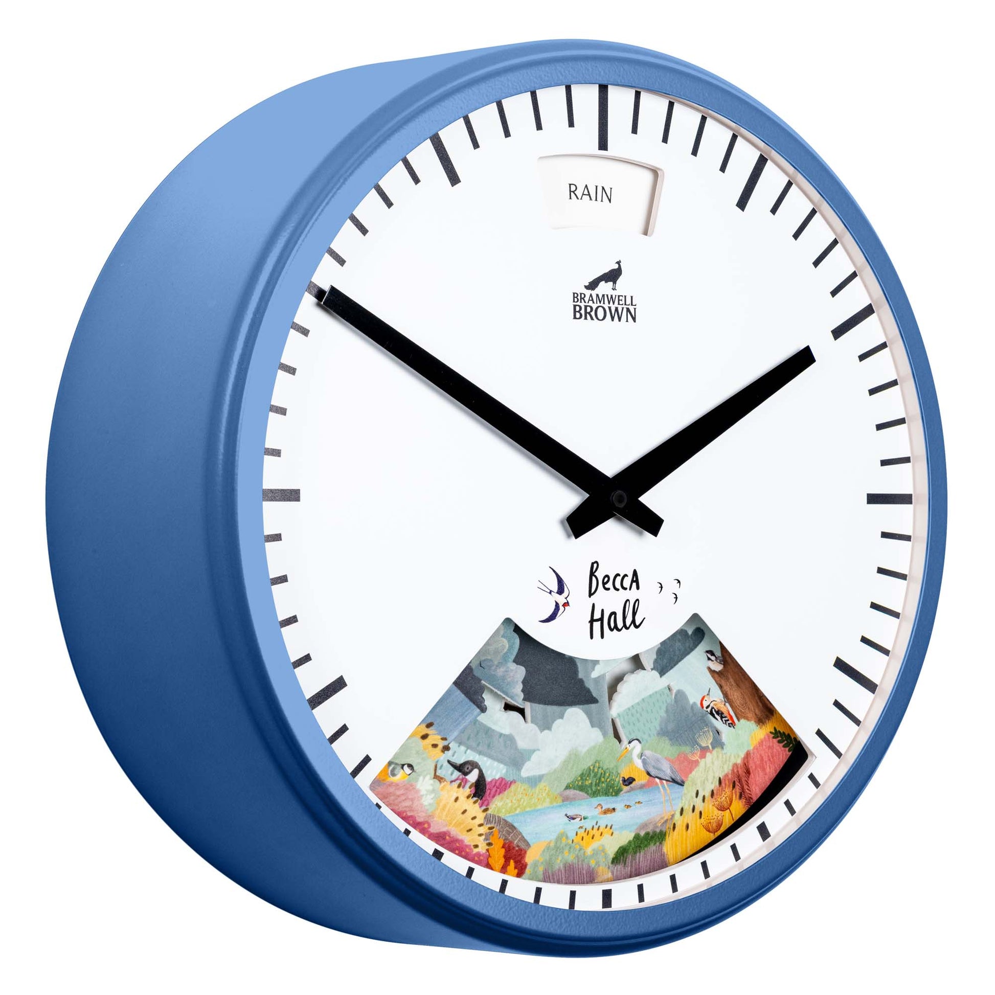 A blue wall clock with black hands, a white face, and a window displaying “RAIN” at the top. The lower section features a colorful illustration of animals in a landscape, signed “Becca Hall.”.