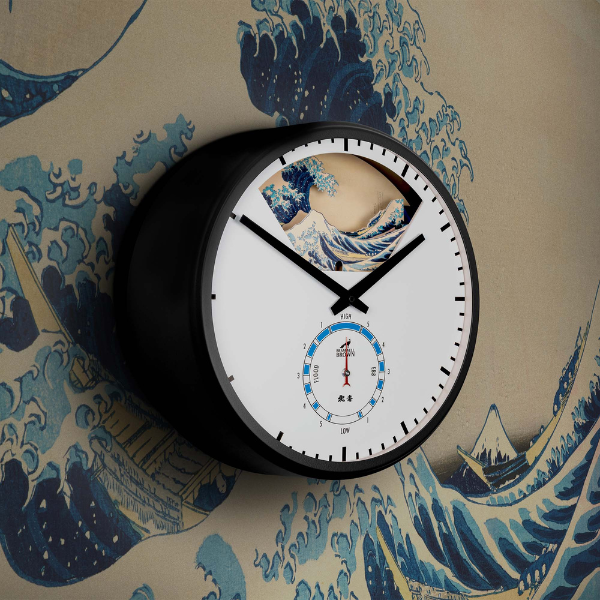 The Hokusai Tide Art Clock features black hands, a minimalist face, and Hokusai’s Great Wave Off Kanagawa at the top with a matching wave background for striking visual appeal.