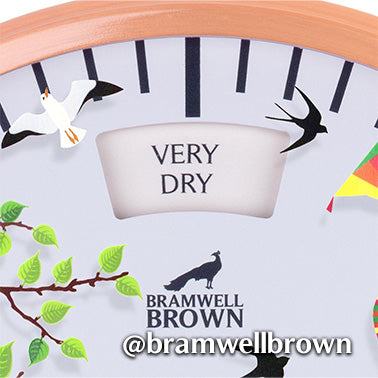 A close-up of a weather dial shows VERY DRY in the center, with bird illustrations, a tree branch with green leaves, and the Bramwell Brown logo and Instagram handle @bramwellbrown at the bottom.