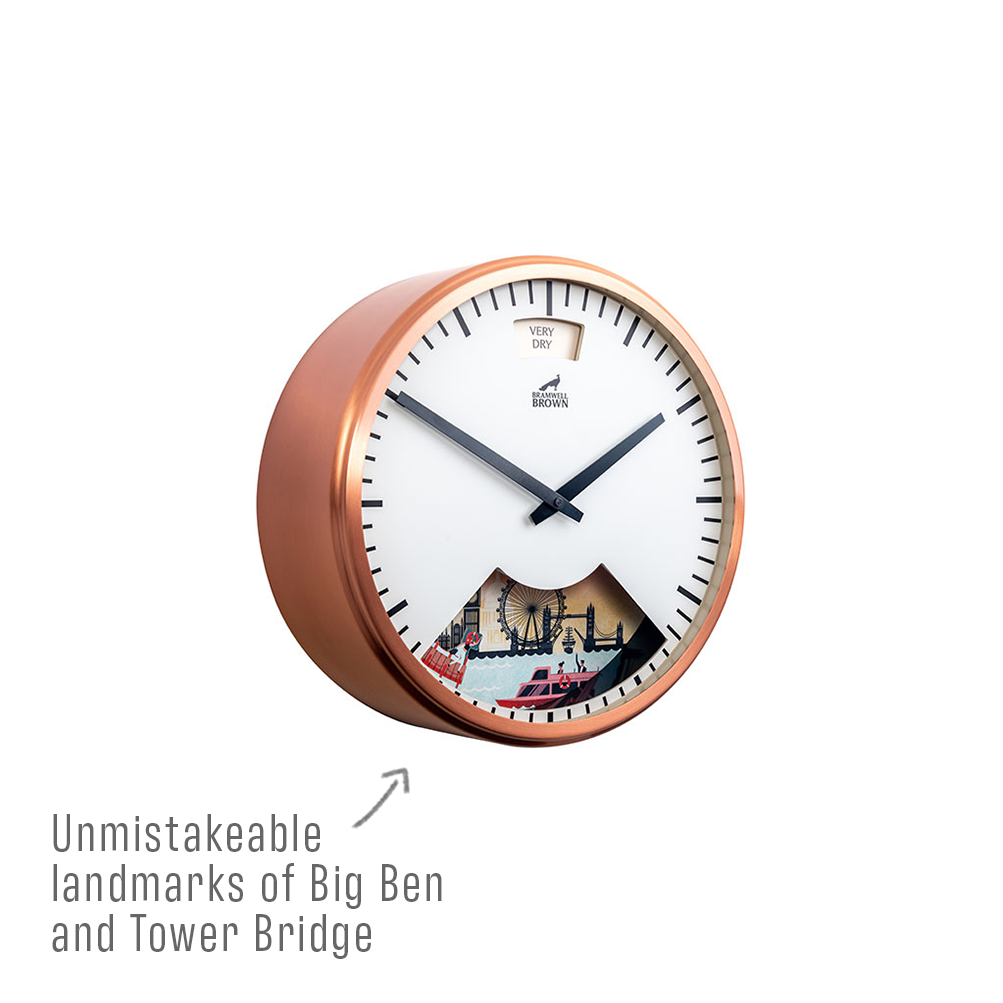 A copper-framed wall clock with simple black hands, featuring illustrated landmarks of Big Ben and Tower Bridge at the bottom of the clock face. Text reads, Unmistakeable landmarks of Big Ben and Tower Bridge.