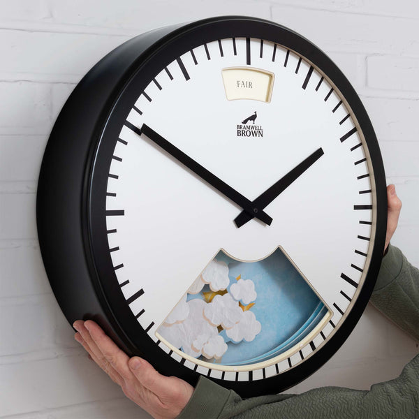 Giant Weather Clock on a painted brick wall