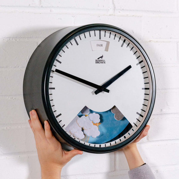 Regular-sized Weather Clock on a painted brick wall
