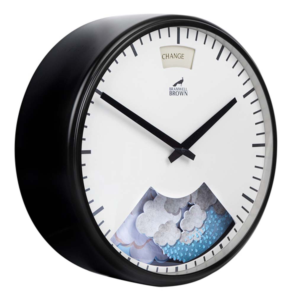 A round wall clock with black frame and hands. The clock face includes a weather display window at the bottom showing clouds and raindrops, and a “CHANGE” indicator at the top. The brand Bramwell Brown is visible.